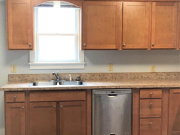 Kitchen has dishwasher and electric stove