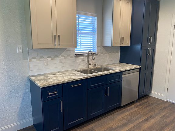 All new kitchen. Tall 42-inch upper cabinets, 24-inch floor-to-ceiling pantry, beautiful granite countertops, custom tile backsplash, deep sink, and new LG dishwasher.