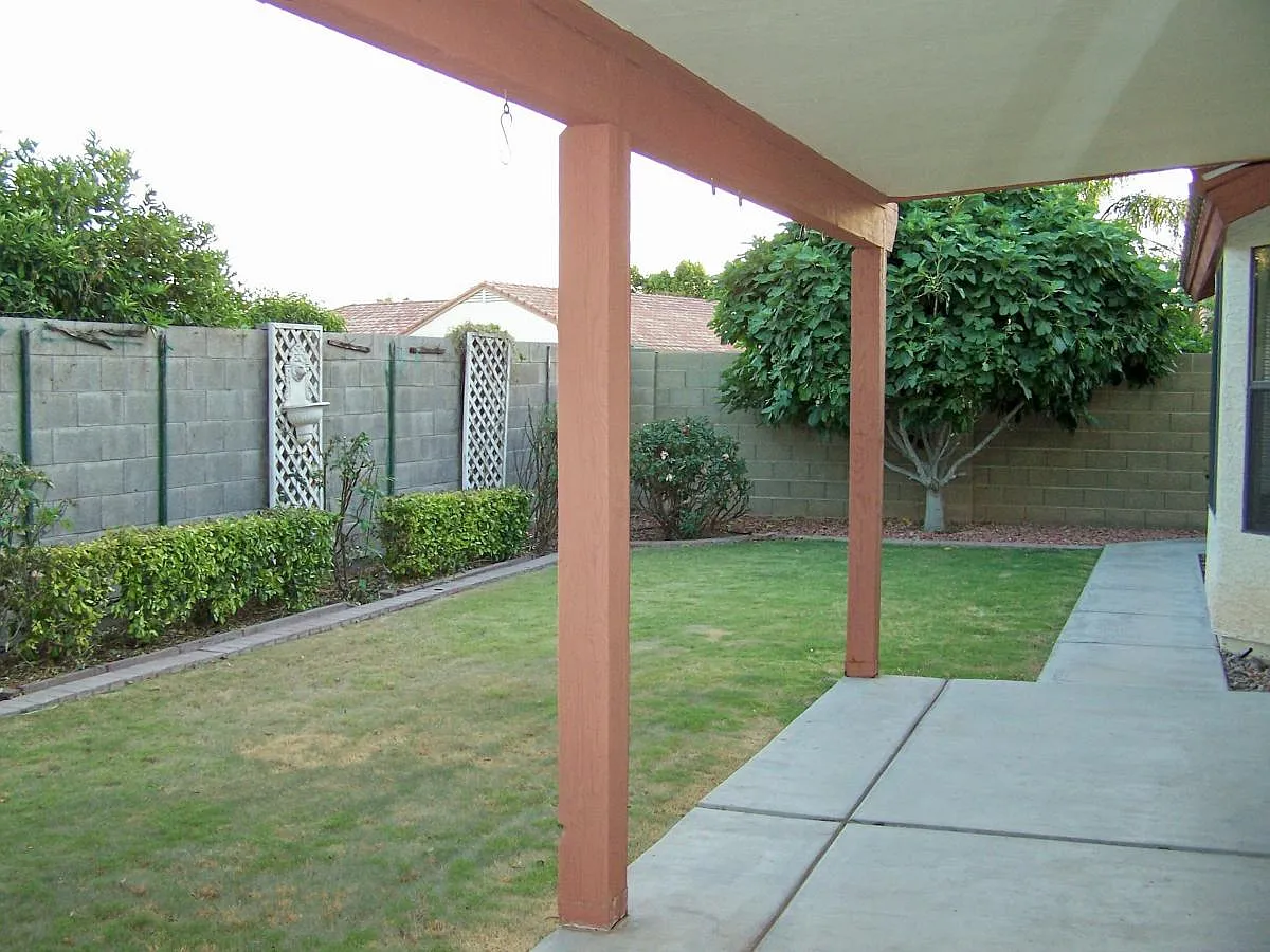 Grassy backyard with covered patio - 7211 W Morrow Dr