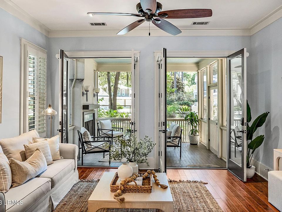 Living room with access to screen porch and huge back yard