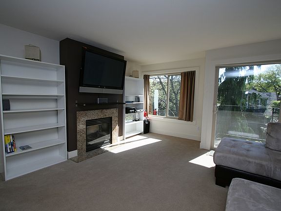 Living room w/gas fireplace + TV