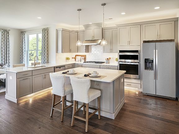 Well-appointed kitchen with large center island and breakfast bar