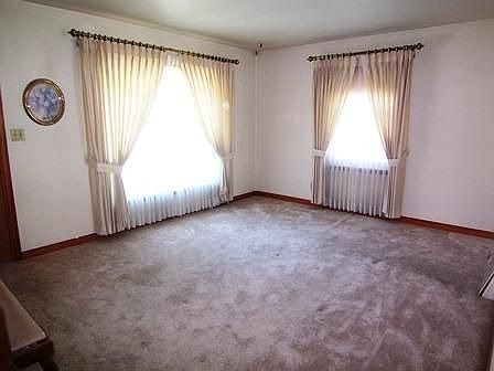 Living room with hardwood floors under carpet!