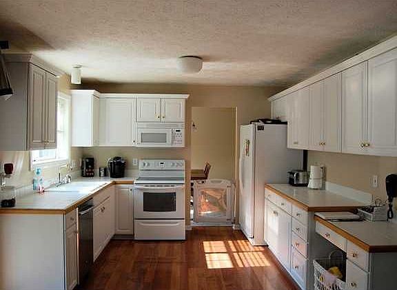 Kitchen has lots of counter & cabinet space, all appliances stay.