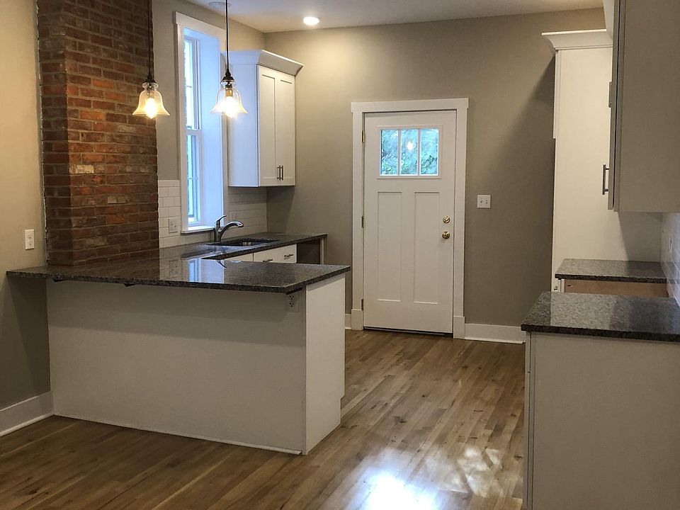 Gorgeous kitchen with stainless steel appliances and granite counters