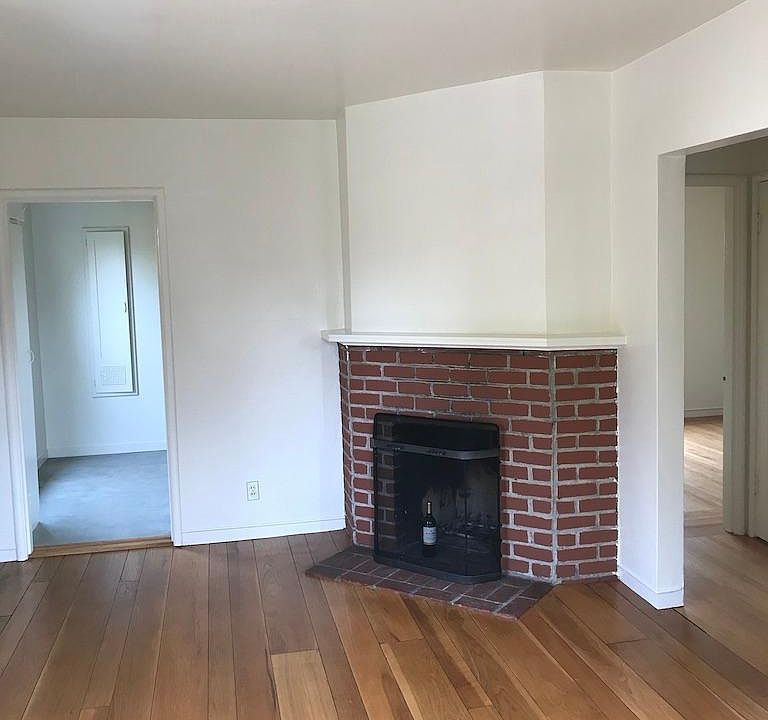 Living room with fresh paint and newly refinished hardwood floors