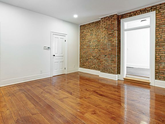 1st floor living room, large coat closet and entry way to dining room