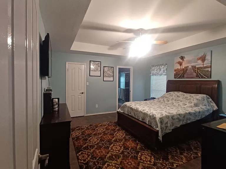 Master bedroom with vaulted ceiling attached full bath with walk in closet