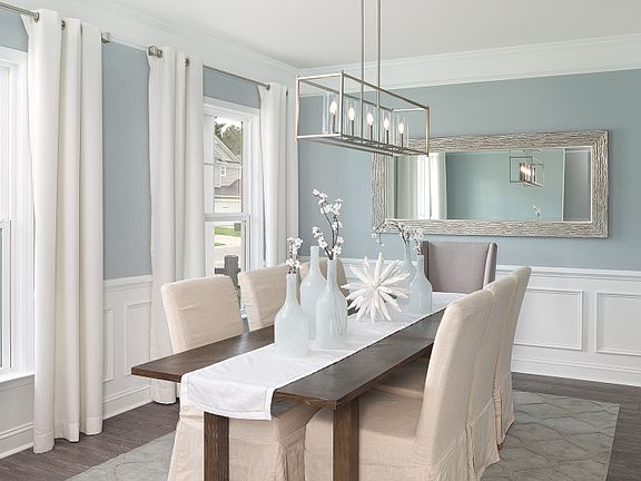 Enjoy a more formal meal in this beautiful Dining Room with elegant trim details