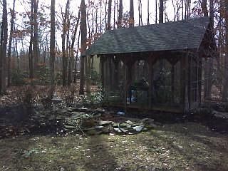 Screen House Near Pond in Backyard