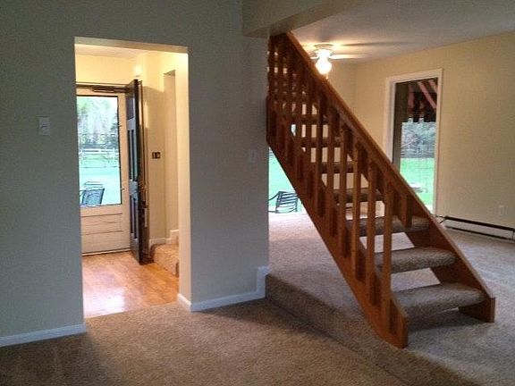 Downstairs living area leading to kitchen and patio