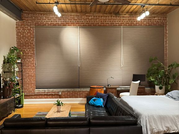 Living area with blackout shades drawn