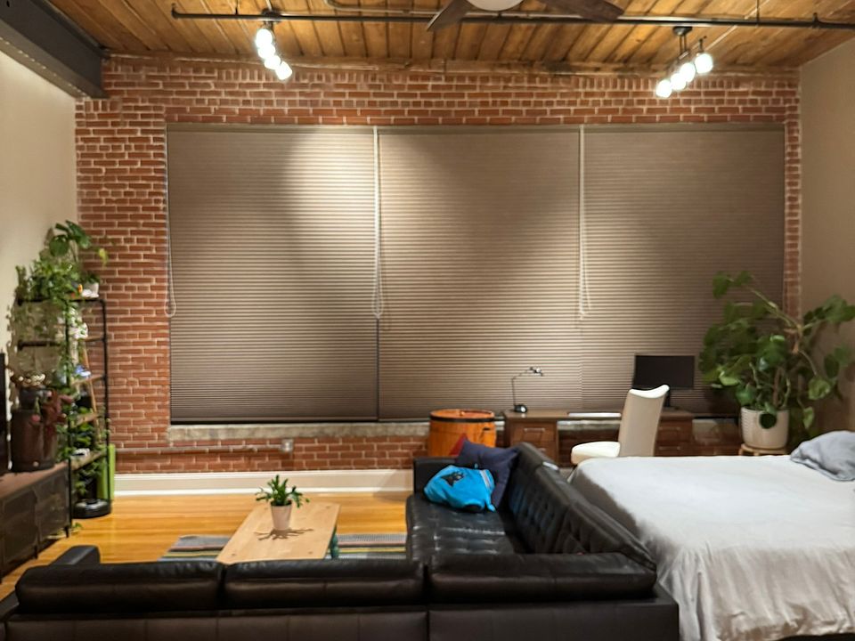 Living area with blackout shades drawn
