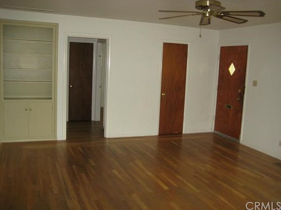 Living room facing south - Main House Built in shelves with coat closet