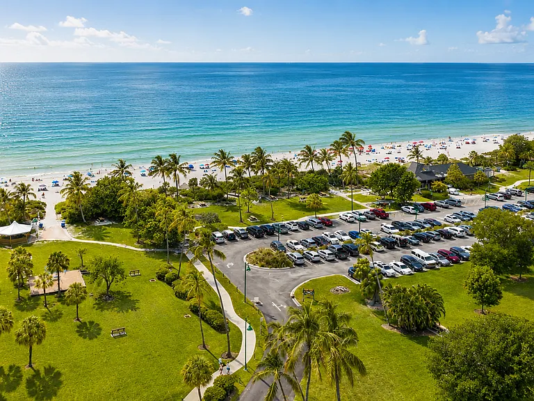 Nearby Naples beaches are perfect for families, with beautiful sand, gentle Gulf waters, sunset views, and convenient parking options right by the beach.