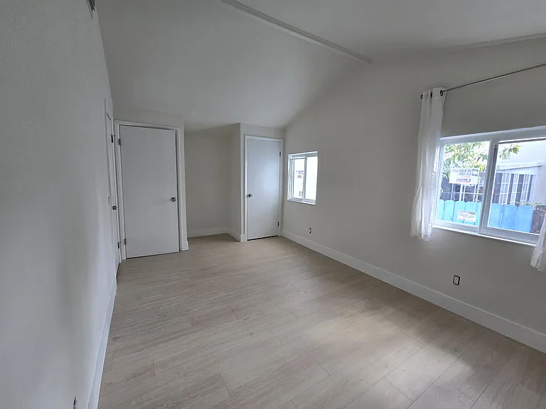 The spacious second bedroom has double closets