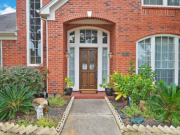 The impressive 2 story entry is tiled. It shows off the staircase to the second floor and divides the the formal living from the formal dining.