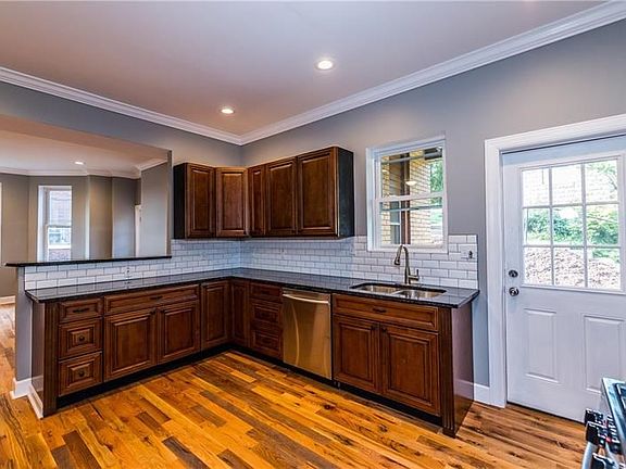 New cabinets with soft closures.   New dishwasher and tile backsplash.   Open to the dining / family room area.  Open floorplan!
