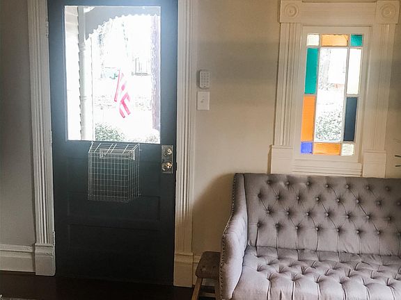 Mail slot in front door and stained glass window
