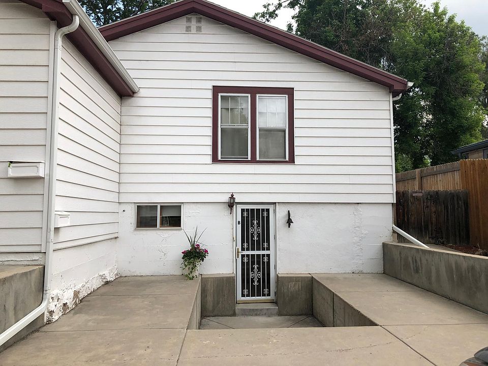 Front entry with area for BBQ and planters. Full sun southing south. Garden level home stays cool in summer.