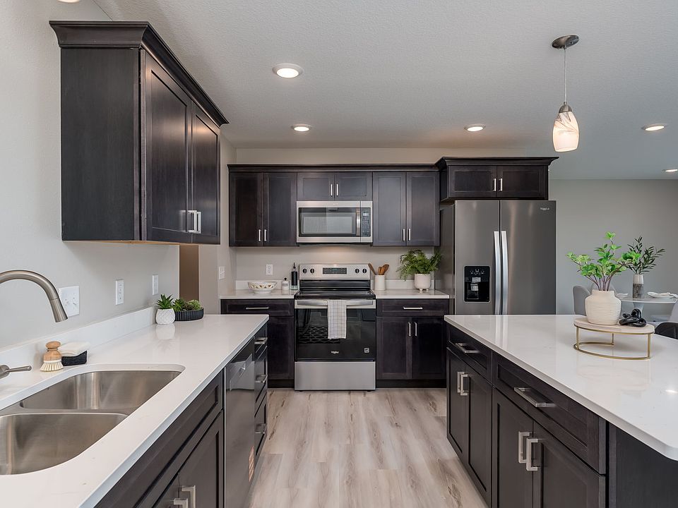 Spacious Kitchen, New Stainless Whirlpool appliances, Quartz tops, soft close drawers, walk in pantry.