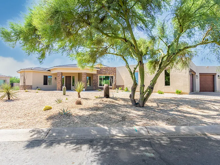 FRONT OF THE HOUSE FROM DESIERTO DR. QUIET STREET, ENDS IN CULDESAC.
