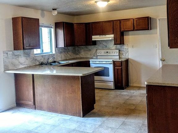 garage entry and extra cupboard space in kitchen