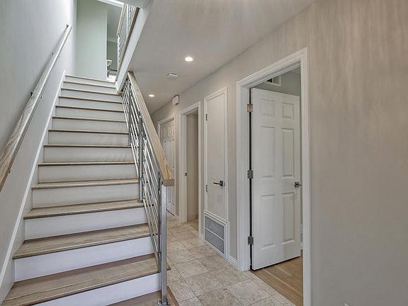 Bedrooms Downstairs, Stairs up to Living Room , Kitchen, Deck, Atrium and Roof Top Patio