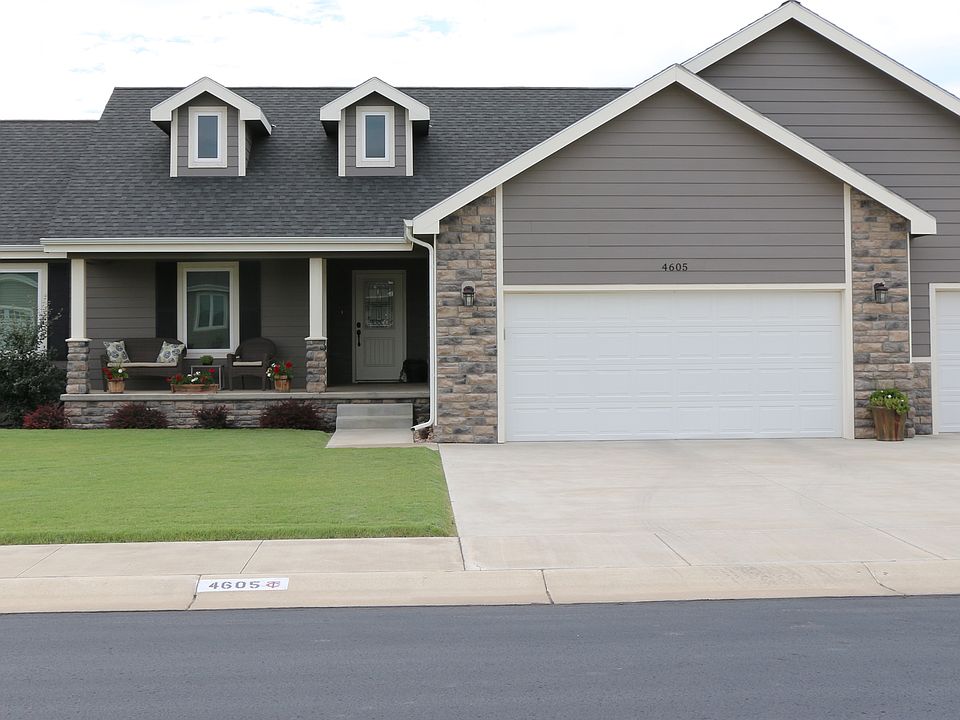Front porch + 3 car garage