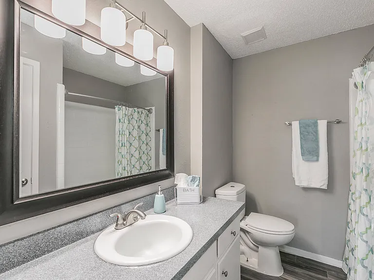 Modern bathroom with bright vanity and large mirror