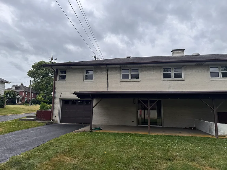Rear Exterior with Patio & Garage