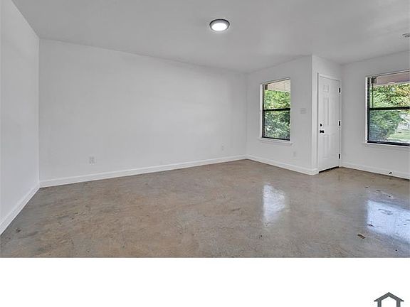 Open interior space with great natural light and fresh paint throughout.