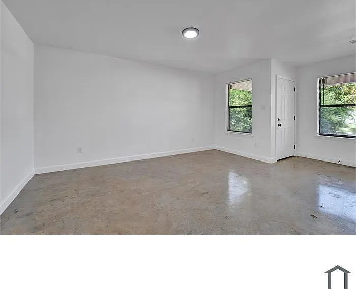 Open interior space with great natural light and fresh paint throughout.