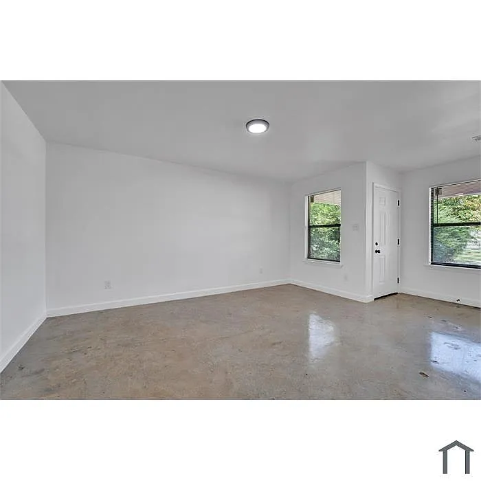 Bright and spacious room with natural light, fresh paint, and a serene atmosphere perfect for relaxing. - 803 Goodwyn St #803