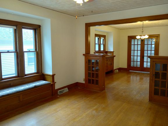 Wood floors greet you in the parlor, dinning room and sun room with built ins, window seat and French doors. Great for entertaining!