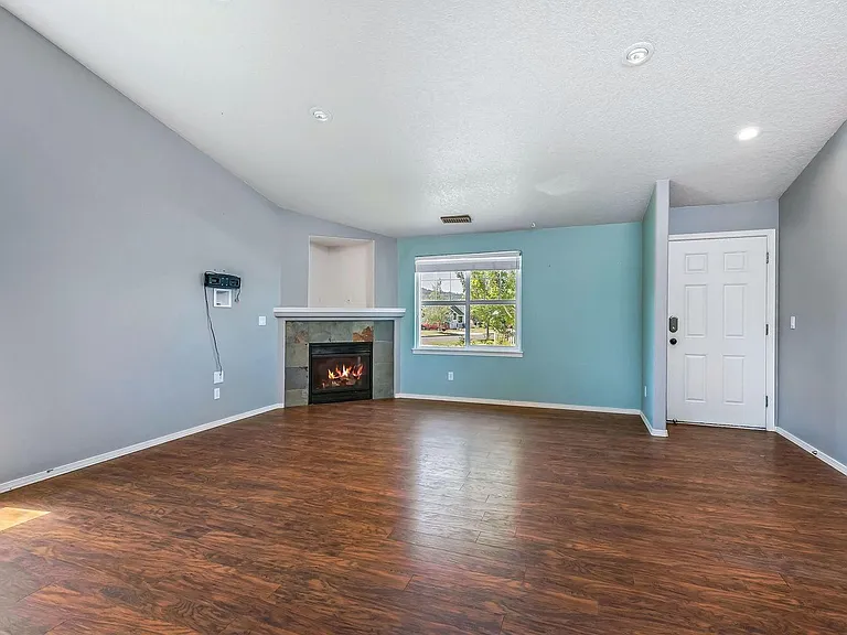 Corner Fireplace, Hard Surface Flooring throughout the home.
