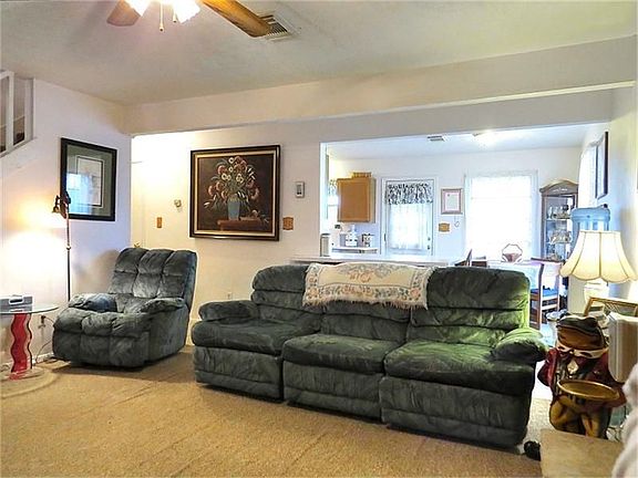 Open floorplan flows through to dining room and breakfast bar.