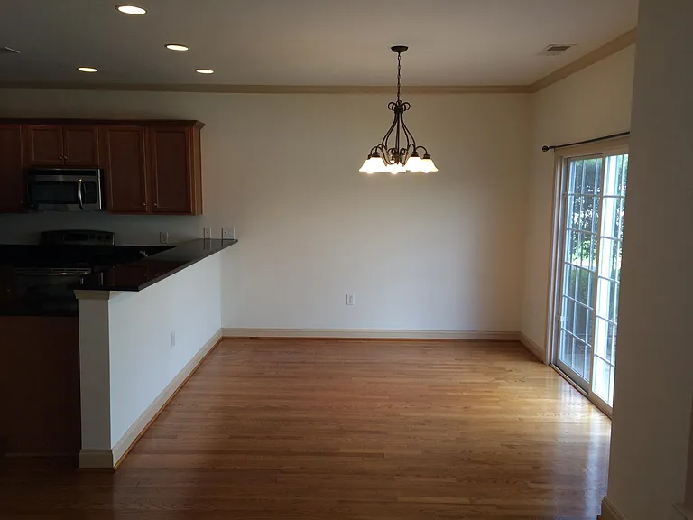 Dining area off the kitchen and sliding glass door to back patio and yard.
Photo doesn't reflect new lighter paint on walls and trim.