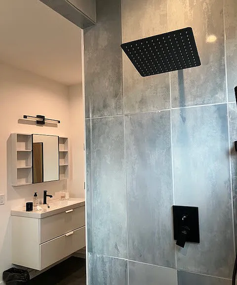 Shower looking into bathroom vanity-primary.