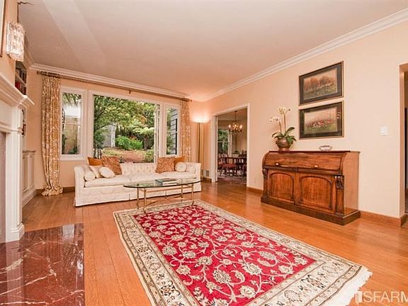 The flow of the floor plan with the living room leading to the terrace and formal dining room is ideal for entertaining.