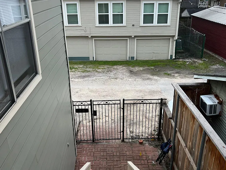 Alley access with locked gate (with code).