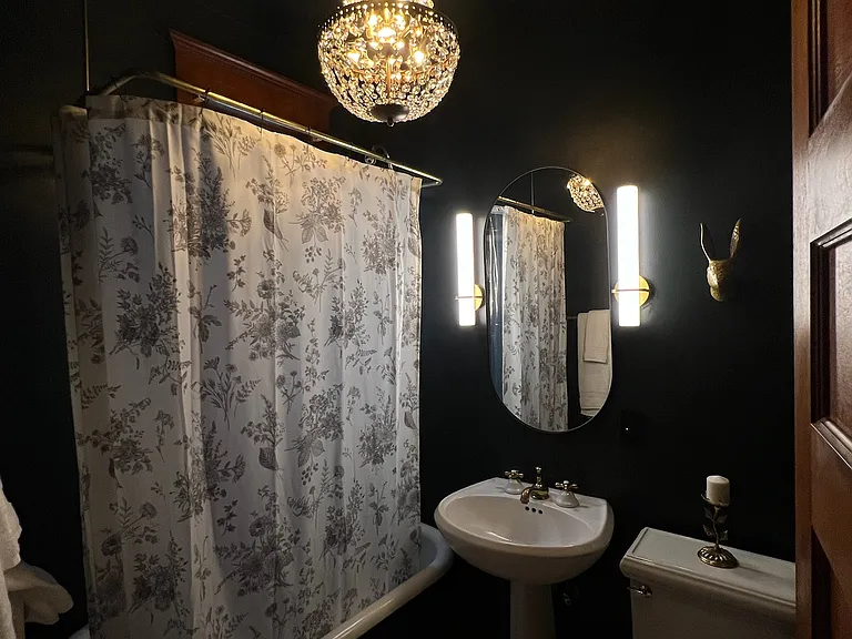Bathroom at night with mood lighting.