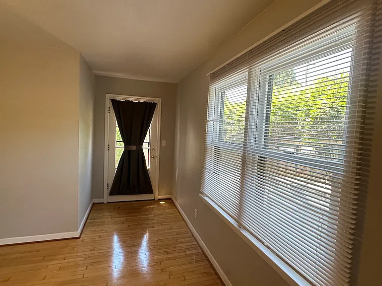 Bedroom 2 with exterior door to the backyard