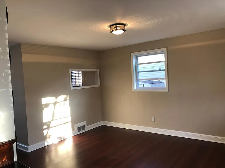 Living room with cut out to Kitchen