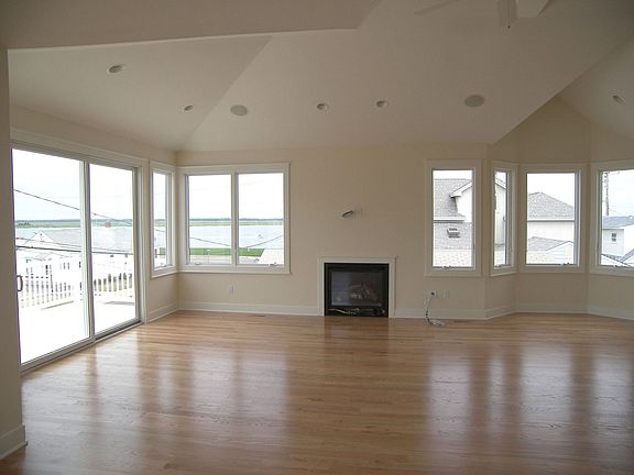 Spacious and open great room with fireplace ...