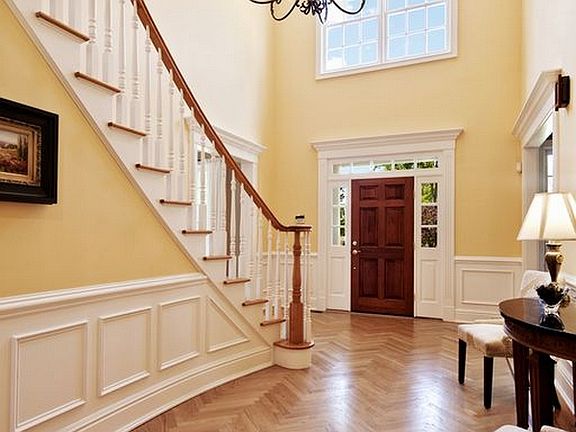 Grand Entryway with Herringbone Hardwood