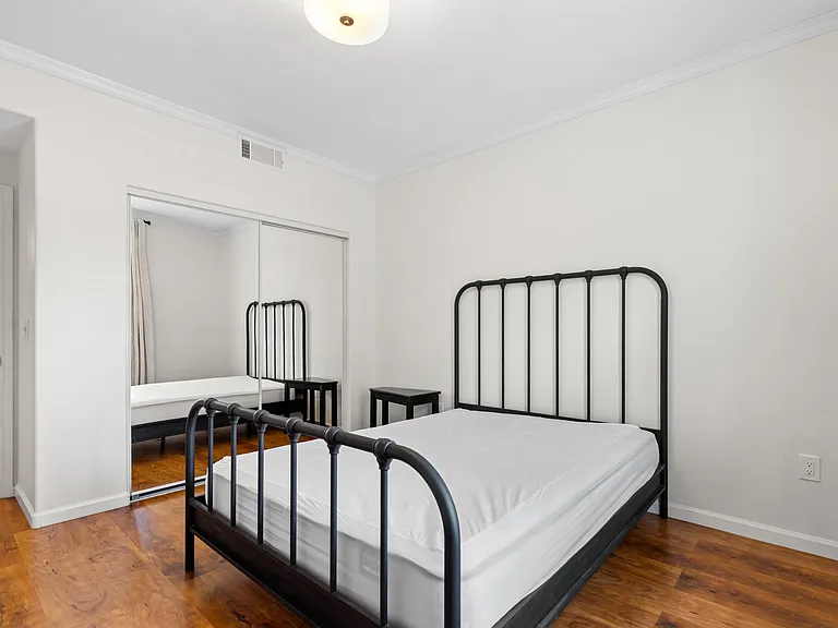 Queen size bed, large dresser for additional storage and black out curtains.