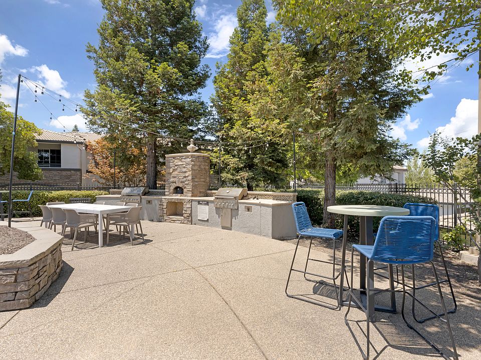 Our tree-lined pool deck features a large pool, jacuzzi, two propane grills, plenty of seating, and scenic viewssteps from the clubhouse and leasing office at Ascent at the Galleria.
