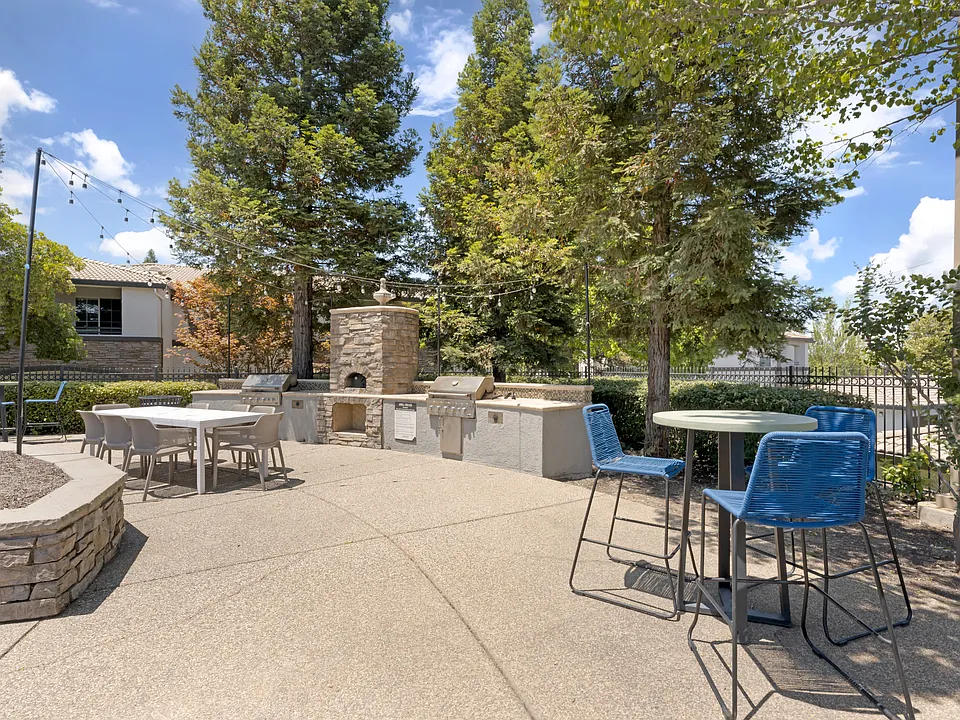 Our tree-lined pool deck features a large pool, jacuzzi, two propane grills, plenty of seating, and scenic viewssteps from the clubhouse and leasing office at Ascent at the Galleria.