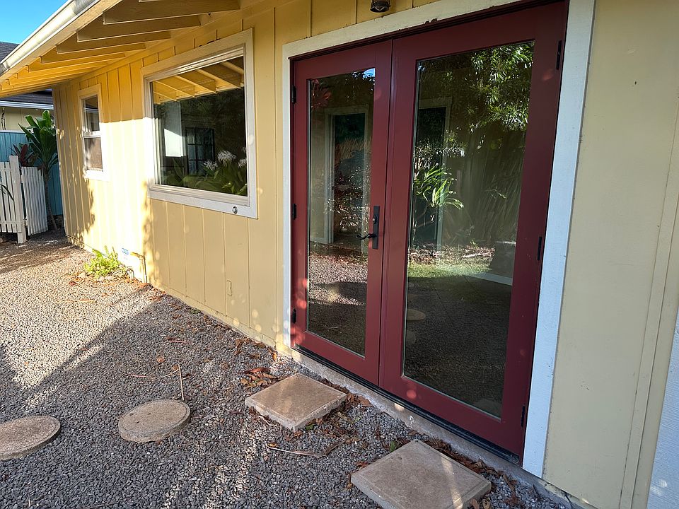 Back French door to gated yard with privacy.